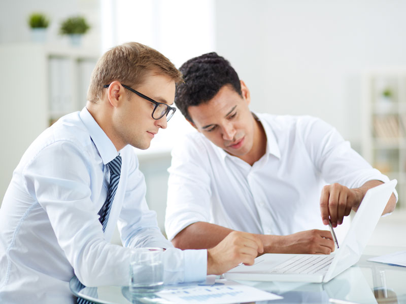 two men collaborating at work